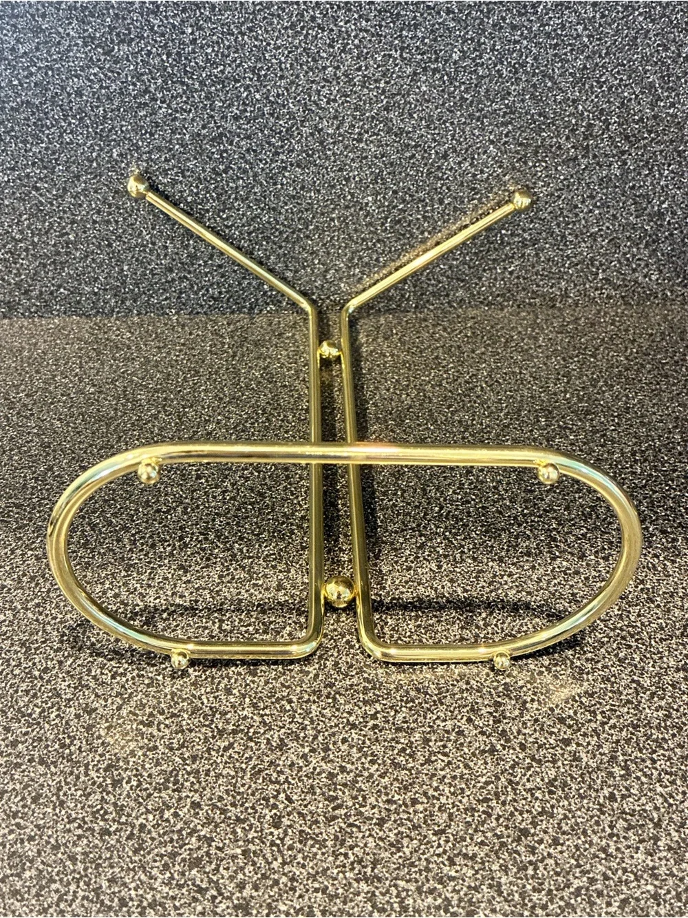 Vintage gold-tone metal countertop vanity hand towel stand